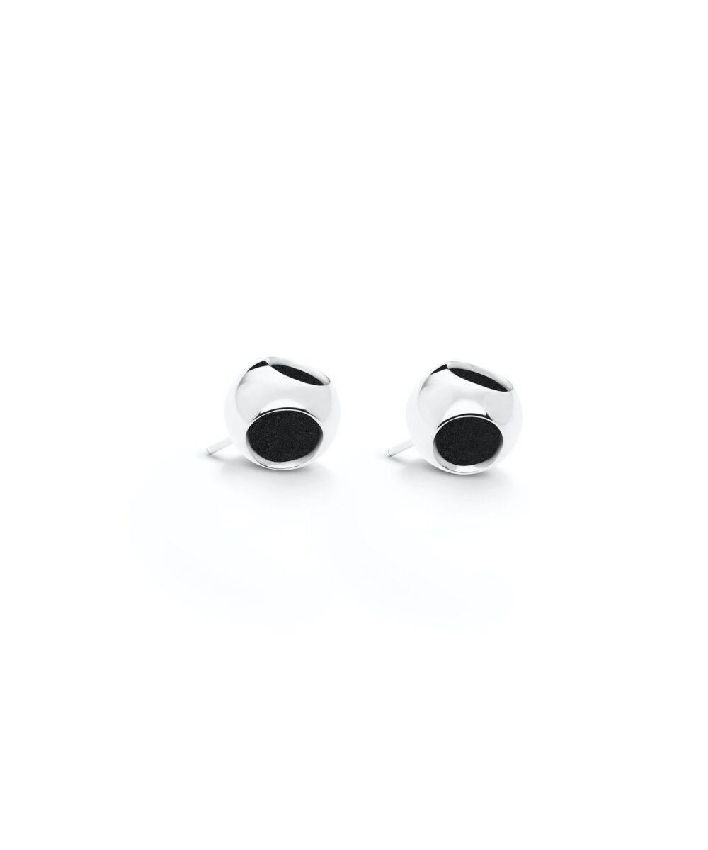 Sleek silver stud earrings with black circular details, perfect for elegant and casual styles.