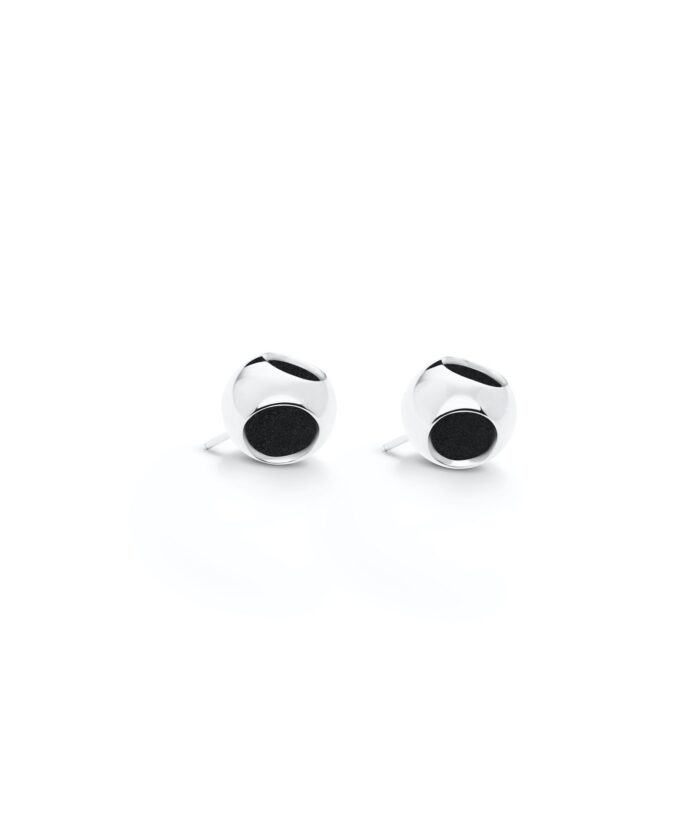 Sleek silver stud earrings with black circular details, perfect for elegant and casual styles.