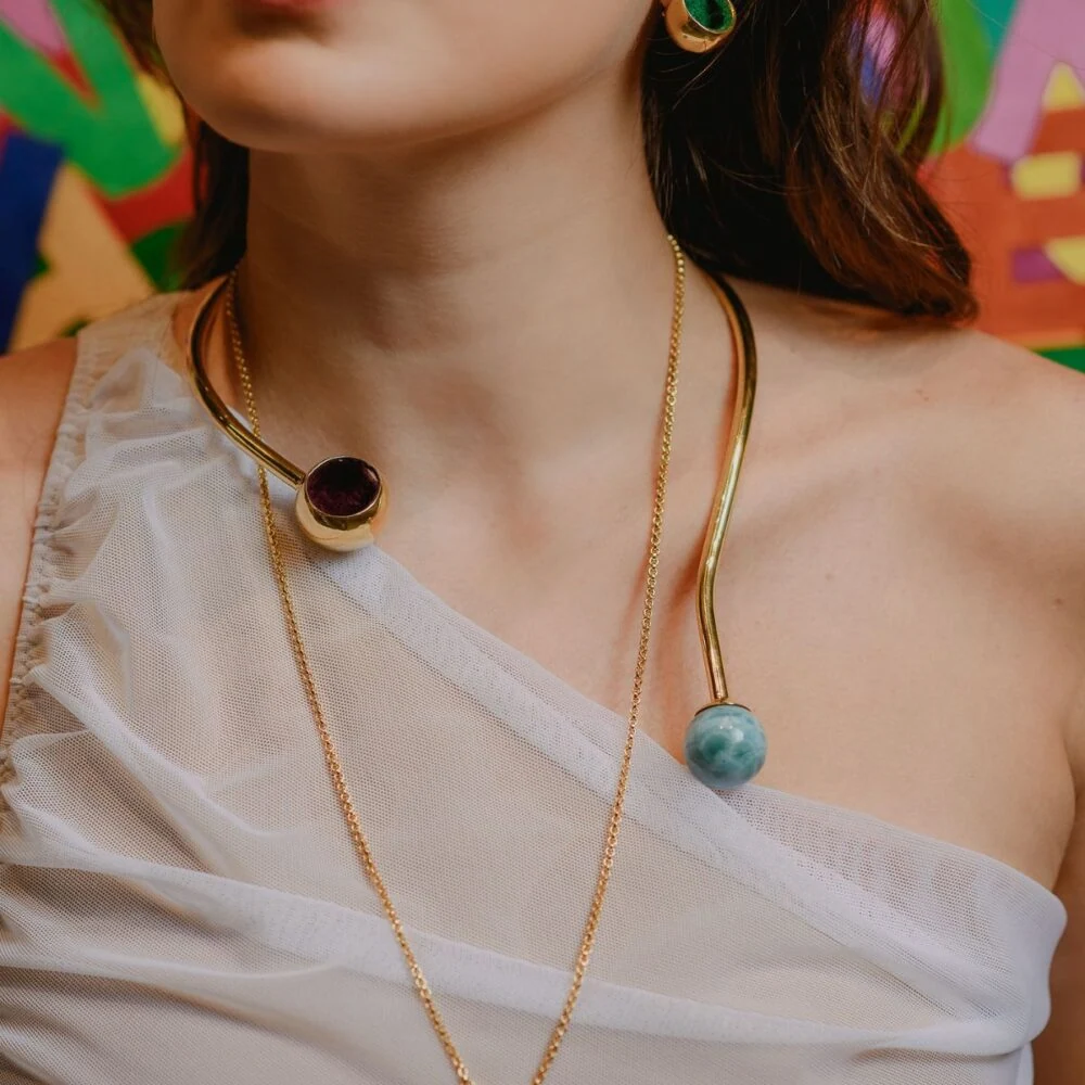 Vivid Larimar and Pyrite gemstone choker necklace featuring gold-tone metal, perfect for stylish accessories.