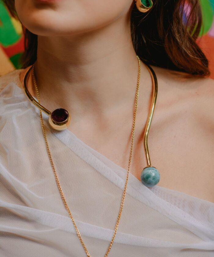 Vivid Larimar and Pyrite gemstone choker necklace featuring gold-tone metal, perfect for stylish accessories.