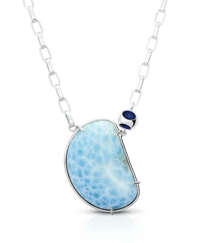 Delicate silver chain necklace with unique larimar gemstone pendant. Perfect for elegant, casual wear.