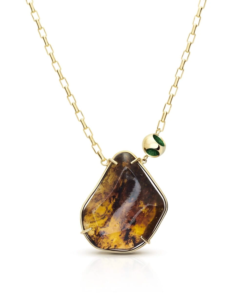 Delicate pendant necklace featuring amber gemstone, sterling silver with 18k gold micron plating, green accents.
