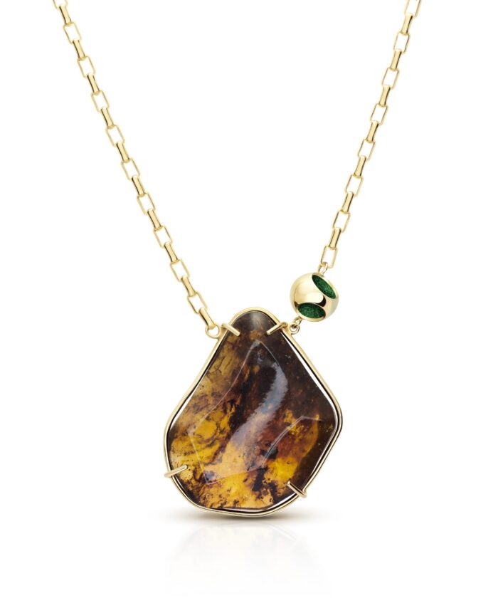 Delicate pendant necklace featuring amber gemstone, sterling silver with 18k gold micron plating, green accents.