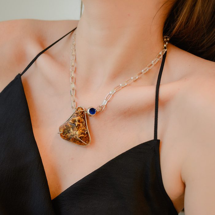 Elegant amber pendant necklace with a delicate chain for stylish women. Perfect accessory for any outfit.