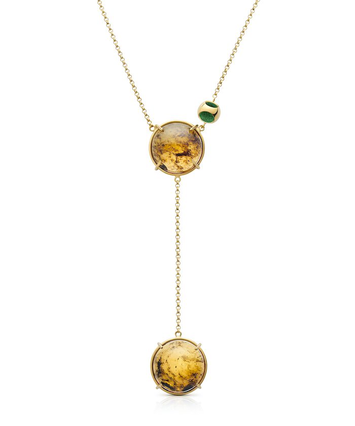 Beautiful gold necklace featuring amber stones with double pendant design. Elegant jewelry for a sophisticated look.