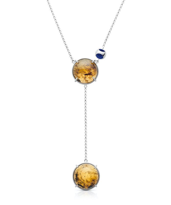 Delicate pendant necklace featuring double amber charms on a silver chain. Elegant jewelry for everyday wear and special occasions.