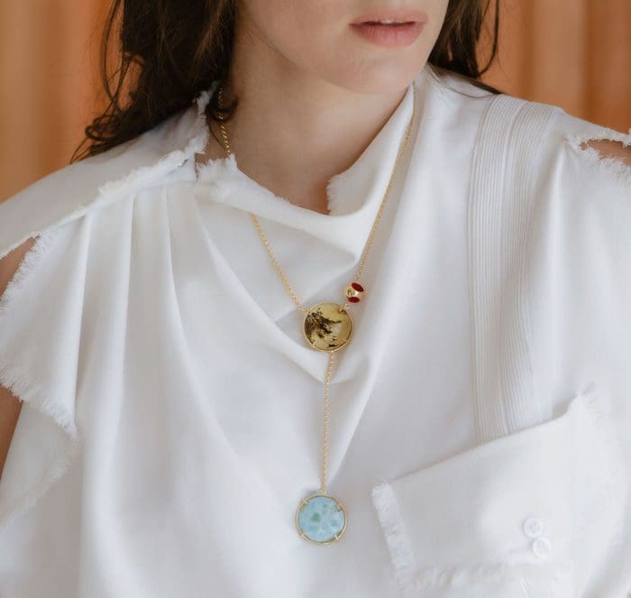 Delicate amber and Larimar pendant necklace, perfect for elegant jewelry lovers and gemstone enthusiasts.
