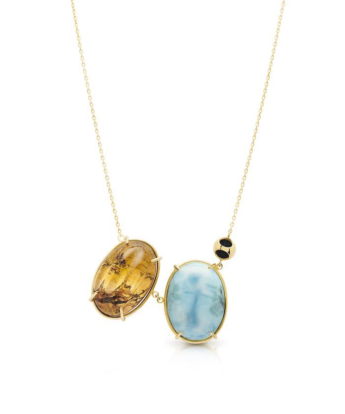 Amber and Larimar pendant necklace with gold accents, perfect for sophisticated jewelry lovers.