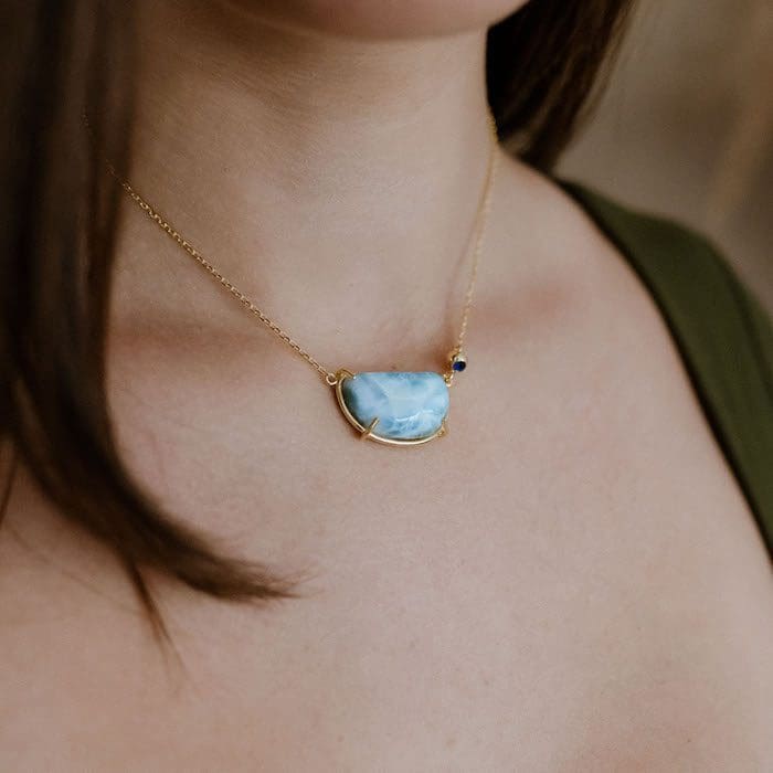 Larimar gemstone pendant necklace with gold chain and minimal design. Perfect for elegant jewelry lovers.