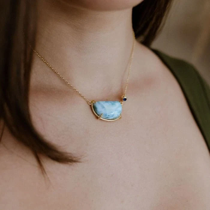 Larimar gemstone pendant necklace with gold chain and minimal design. Perfect for elegant jewelry lovers.