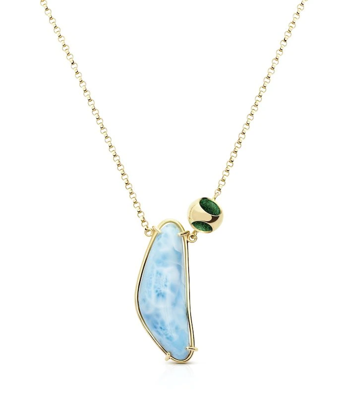 Elegant larimar pendant jewelry for women, featuring gold accents and a unique design.