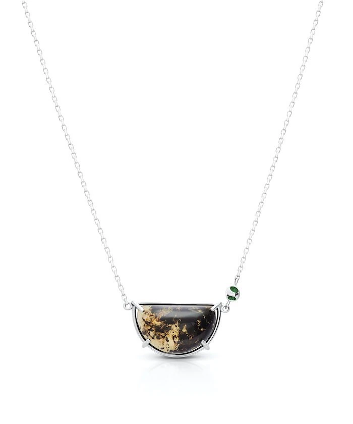 Sterling silver amber pendant necklace with green accents, perfect for elegant jewelry lovers.