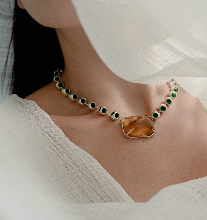 Elegant Amber Infinity Necklace with Green Accents for Women.
