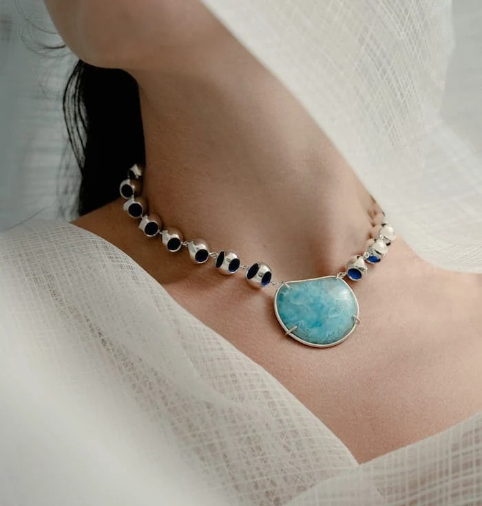Larimar gemstone choker with silver beads, stylish jewelry accessory for women.