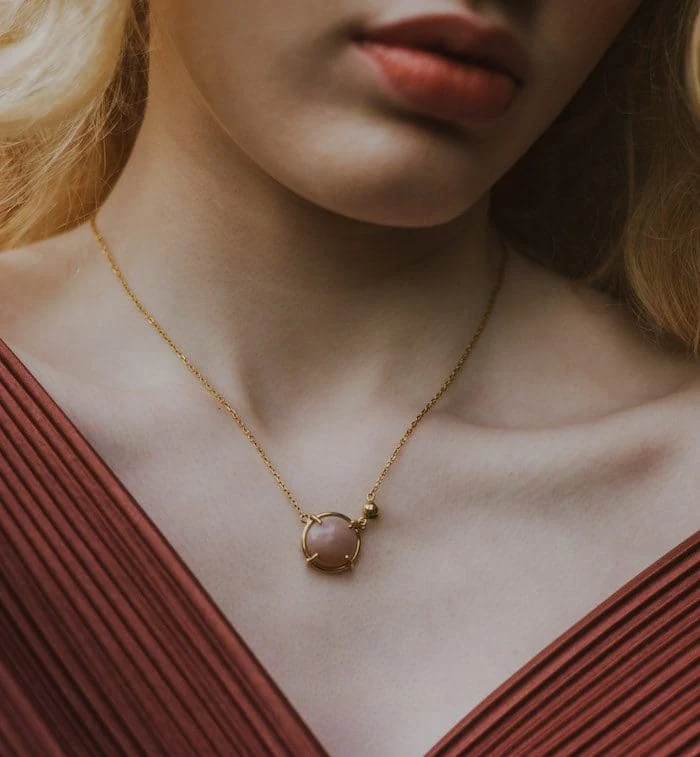Elegant moonstone pendant jewelry featuring gold chain for women, stylish accessory for special occasions.