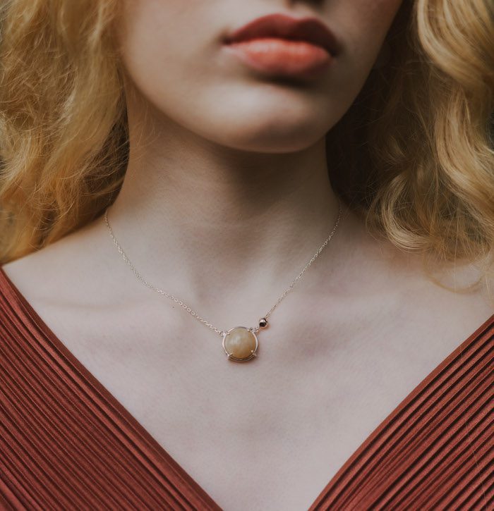 Elegant moonstone pendant necklace with silver chain and minimal design for women.