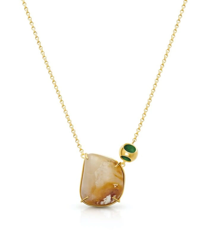Delicate moonstone pendant necklace by Monica Varela with gold chain, perfect for elegant jewelry lovers.