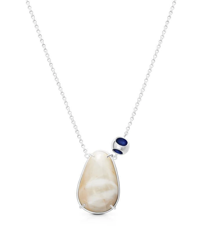 Elegant moonstone pendant with silver and blue accents, perfect for sophisticated jewelry lovers.
