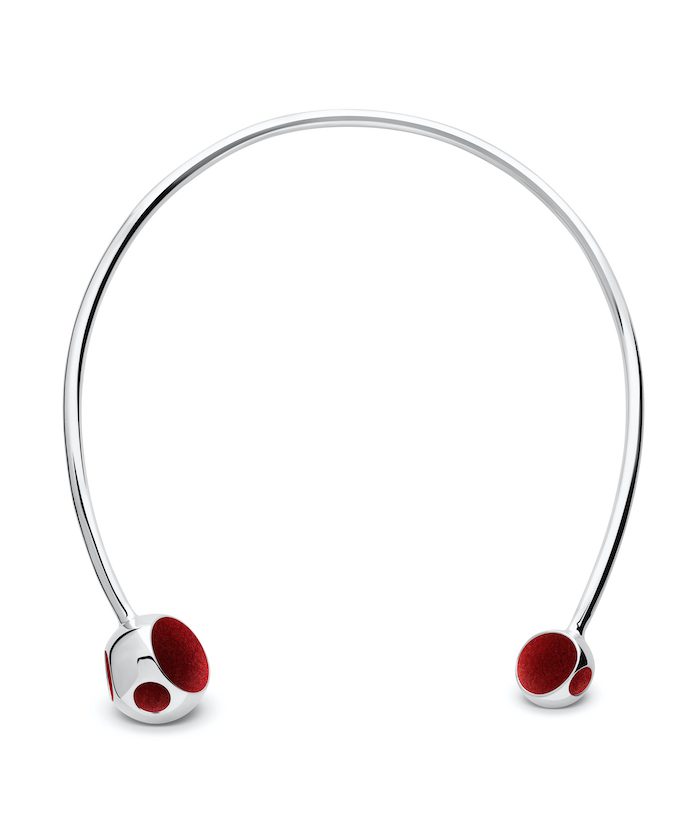 Stylish silver necklace with red accents, modern jewelry accessory for fashion enthusiasts.