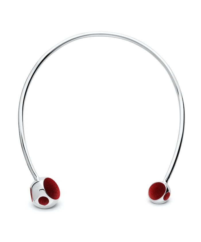 Stylish silver necklace with red accents, modern jewelry accessory for fashion enthusiasts.
