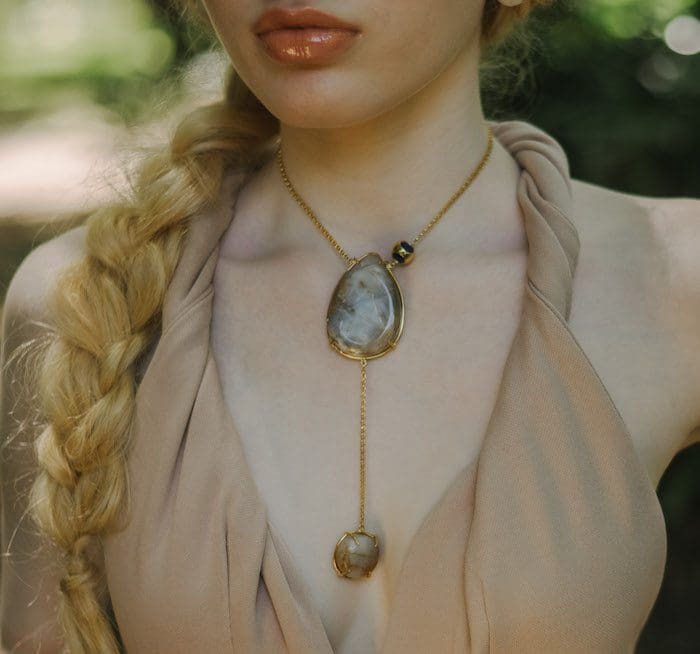 Beautiful double moonstone pendant necklace with gold chain, elegant jewelry for women.