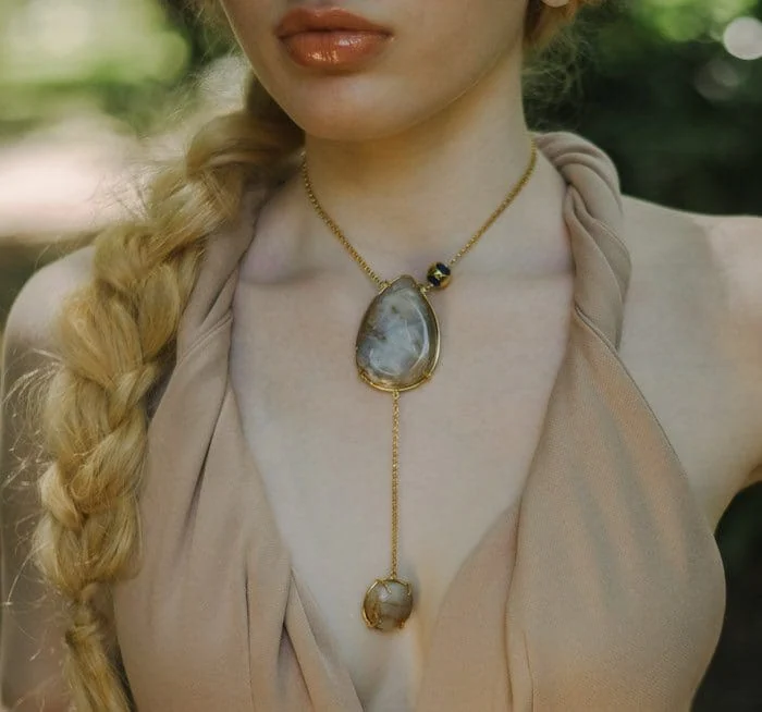 Beautiful double moonstone pendant necklace with gold chain, elegant jewelry for women.