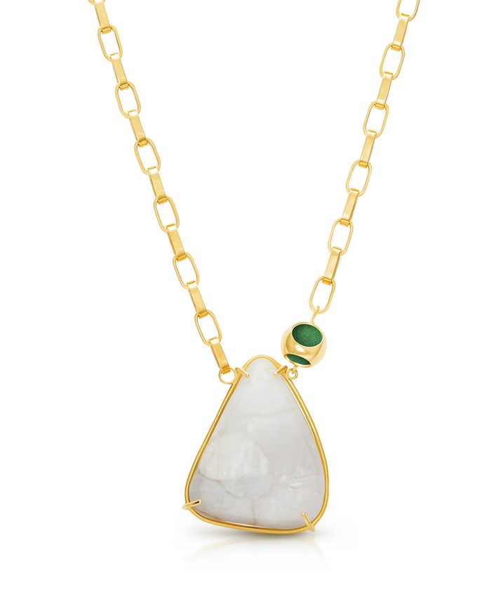 Delicate gold chain with a large moonstone pendant and green accent bead, perfect for sophisticated jewelry lovers.