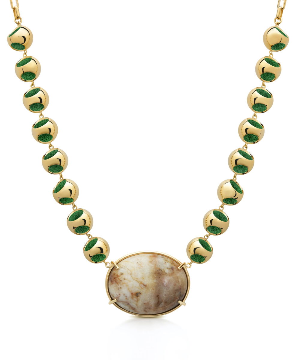 Gold necklace with moonstone and green enameled beads, elegant jewelry accessory.