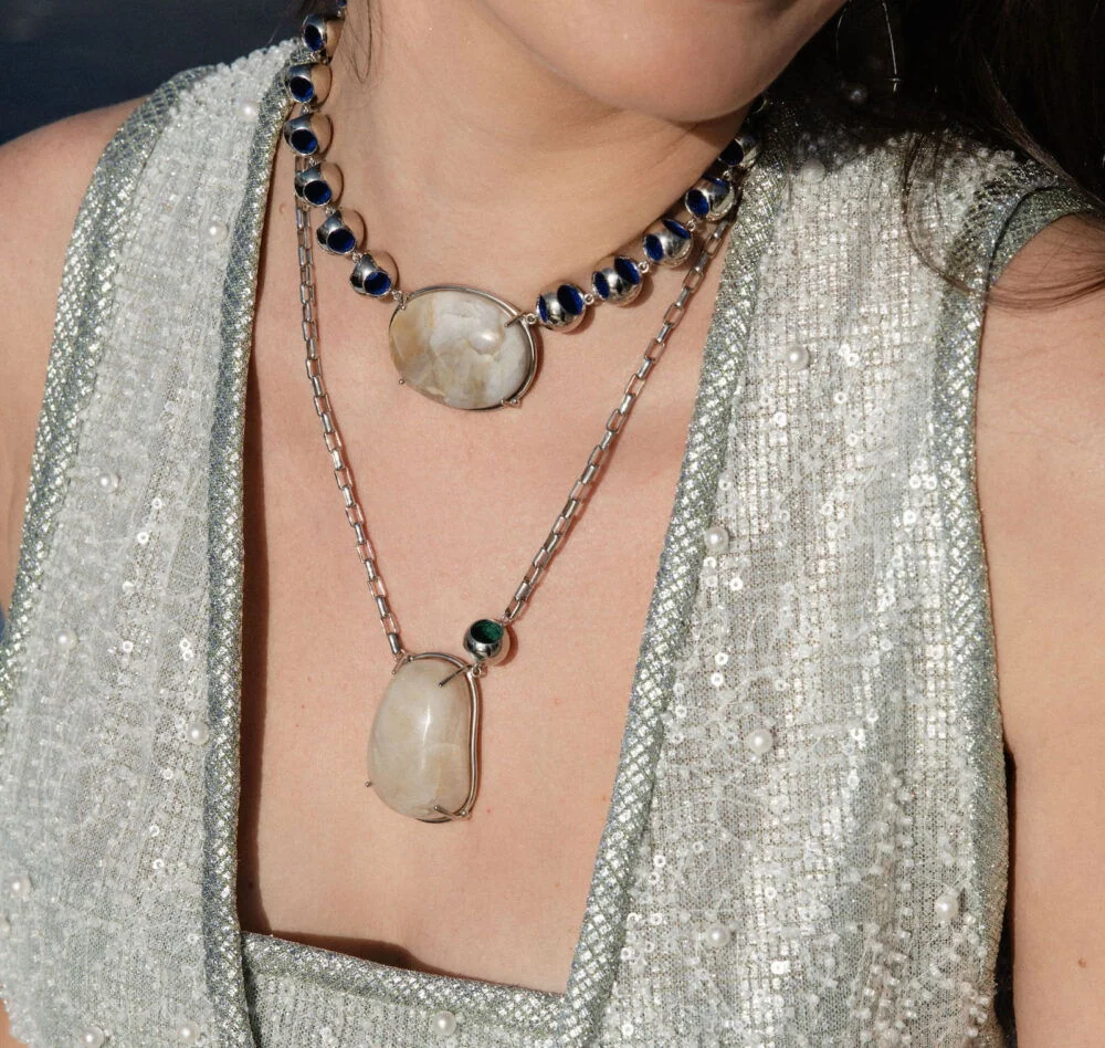 Stunning infinity moonstone necklace with layered chains and elegant design. Perfect for fashion-forward women.