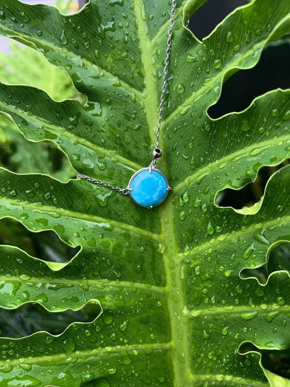 Larimar pendant necklace with turquoise gemstone on silver chain, perfect for boho jewelry lovers.