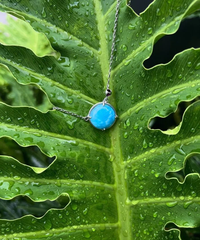 Larimar pendant necklace with turquoise gemstone on silver chain, perfect for boho jewelry lovers.