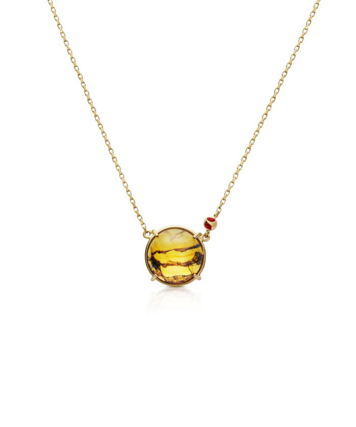 Elegant amber circle pendant on gold chain, perfect for everyday luxury and standout jewelry.