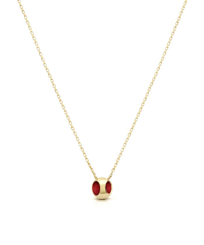 Elegant red enamel pendant on fine gold-tone chain, perfect for sophisticated jewelry styles.