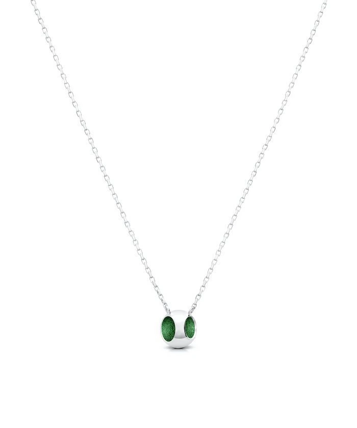 Delicate sterling silver pendant with jazzy green accents and platinum micron plating. Perfect for elegant jewelry styles.