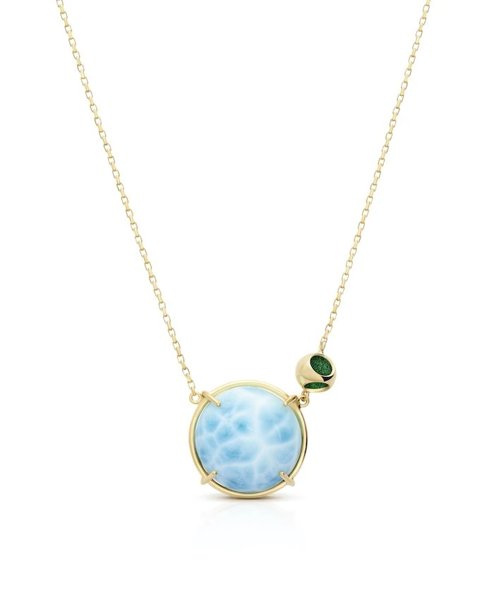 Elegant larimar gemstone necklace with gold chain and green accents. Perfect for summer jewelry.