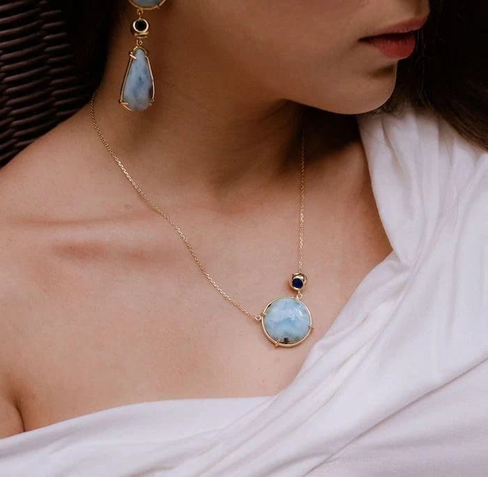 Elegant turquoise pendant necklace and matching earrings, crafted by Monica Varela for stylish jewelry lovers.