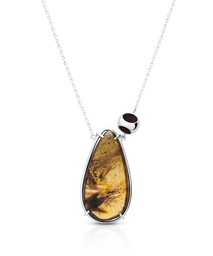 Delicate amber necklace with silver accent for elegant jewelry lovers.