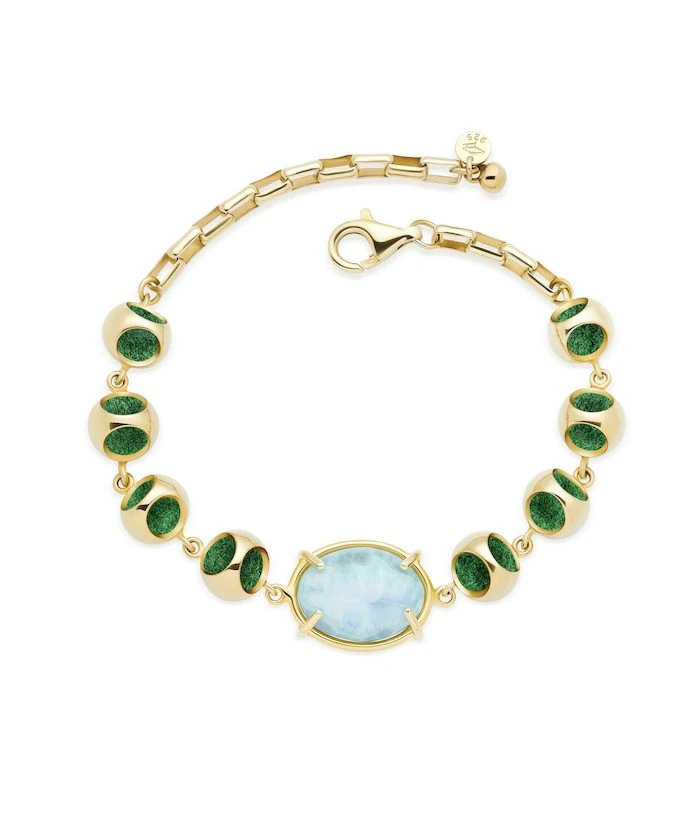 Luxury Larimar bracelet featuring gold-tone details and vibrant blue stones.