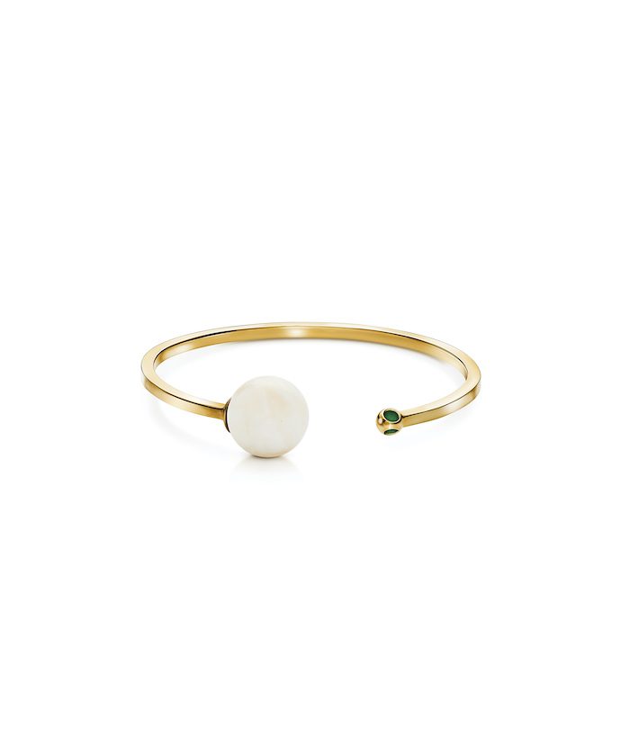 Stunning gold cuff bracelet with pearl and green gemstone accents, perfect for stylish accessorizing.