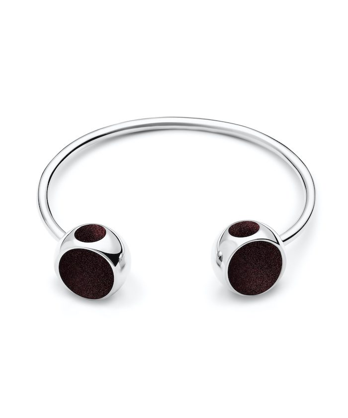 Elegant silver bangle with black accents, perfect for modern jewelry lovers.