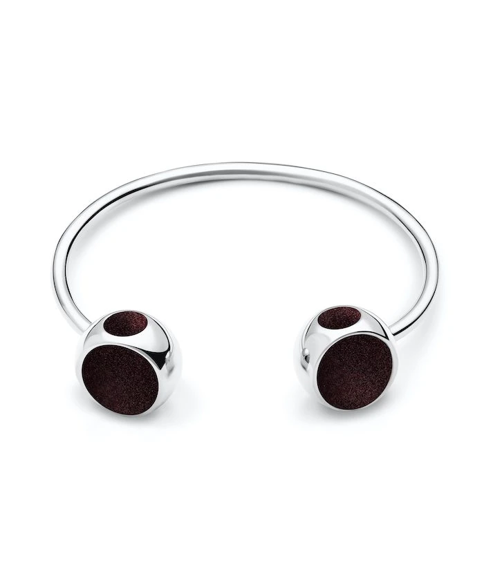 Elegant silver bangle with black accents, perfect for modern jewelry lovers.