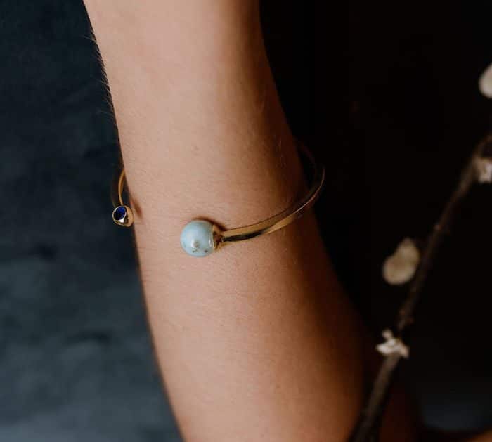 Elegant pearl and blue gemstone bracelet for women.