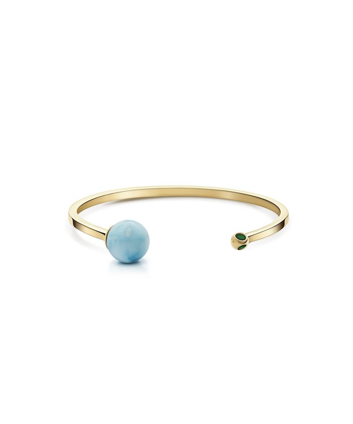 Elegant gold cuff bracelet with a stunning Larimar gemstone accent. Perfect for stylish jewelry lovers.