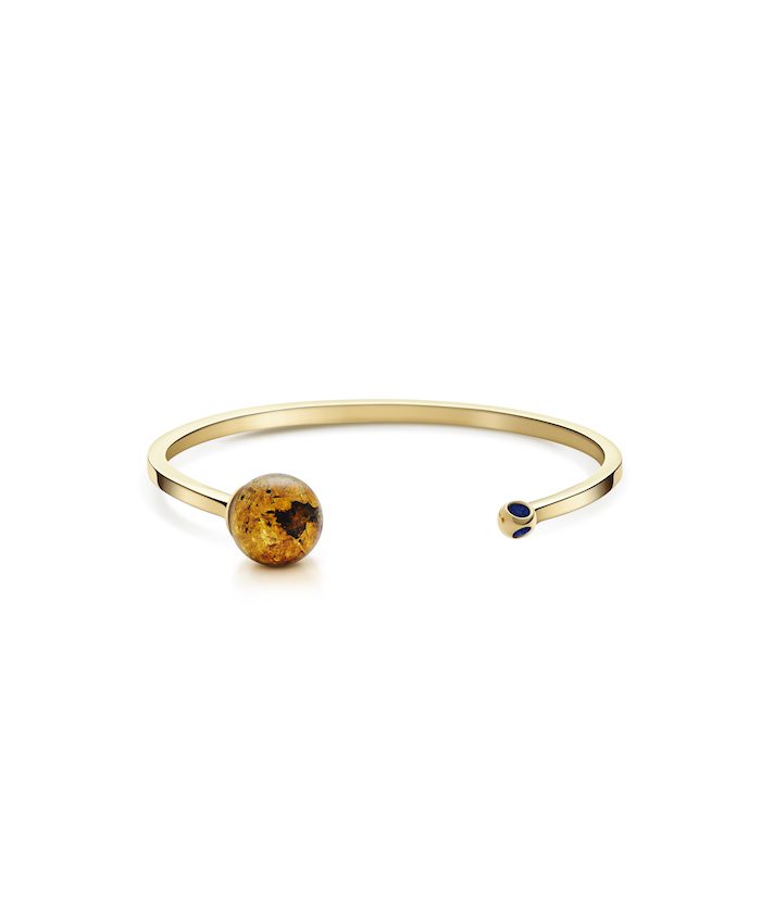 Elegant gold bracelet with amber and navy accents, perfect for stylish jewelry lovers.