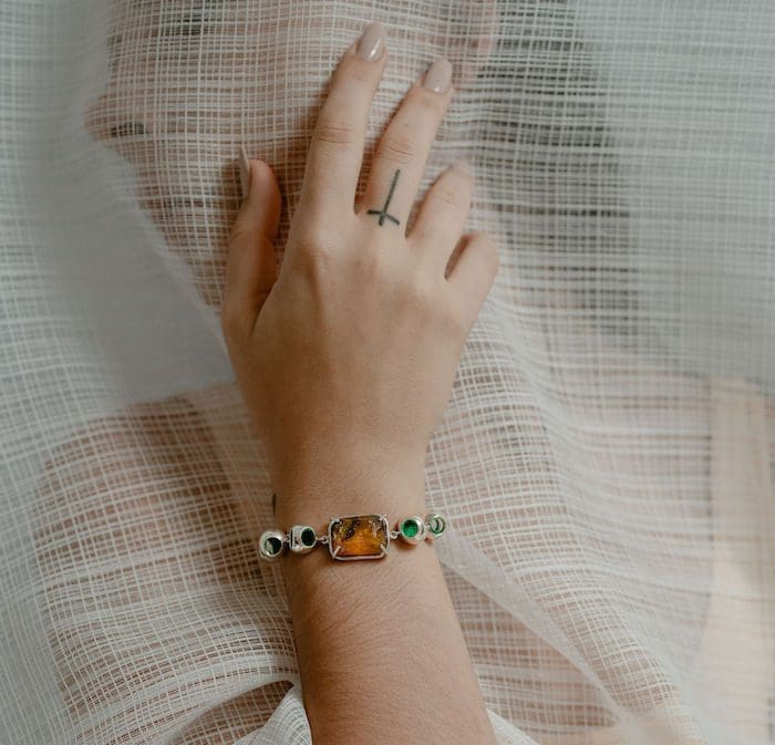 Delicate amber jewelry with silver accents, perfect for elegant accessories.