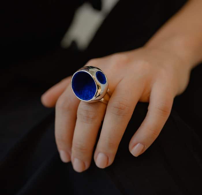 Elegant large blue gemstone cocktail ring for women, statement jewelry, luxury accessory, Monica Varela style.