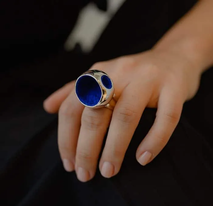 Elegant large blue gemstone cocktail ring for women, statement jewelry, luxury accessory, Monica Varela style.
