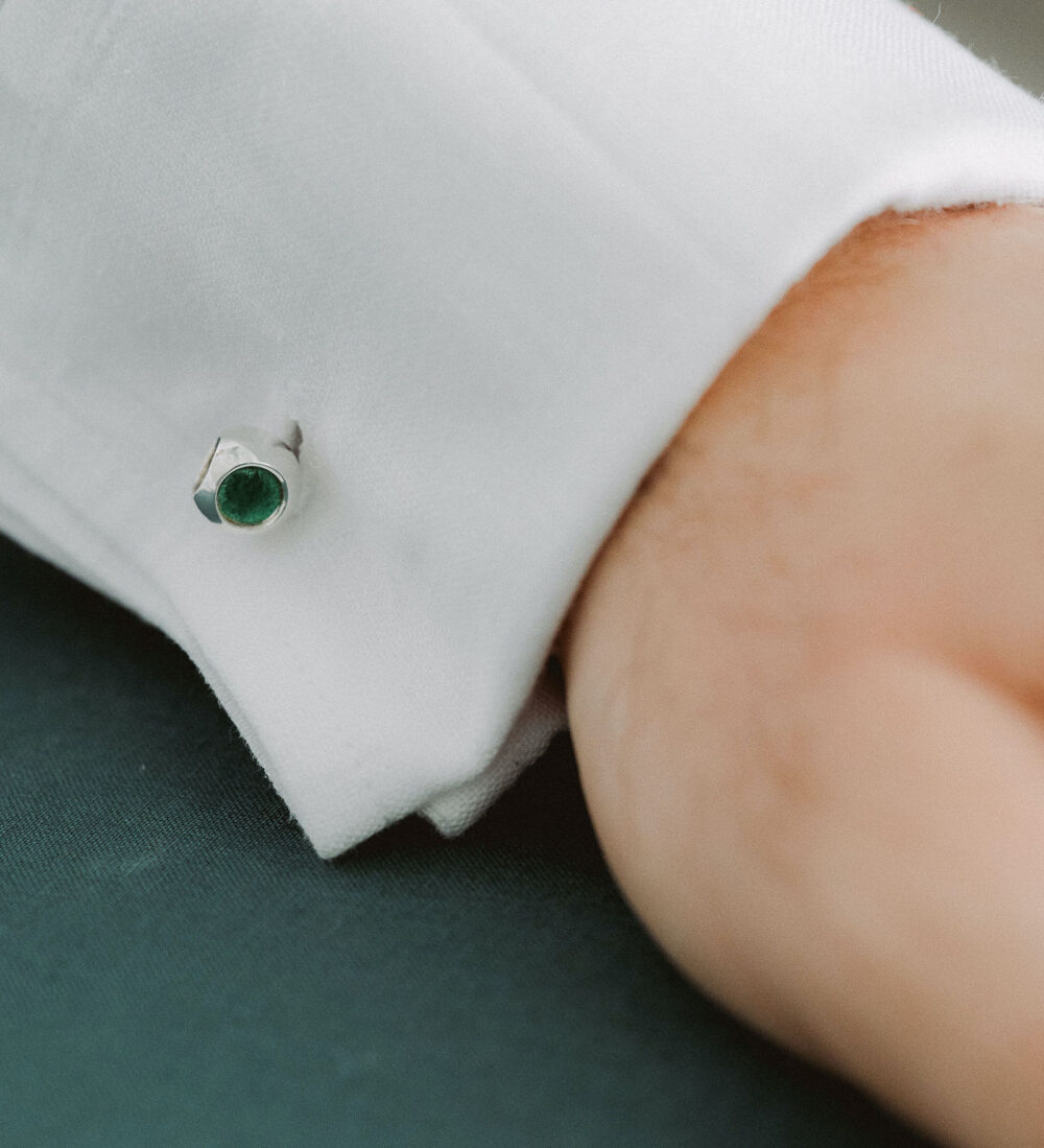 Elegant green gemstone cufflink for men's formal wear. Perfect accessory for dress shirts and special occasions.