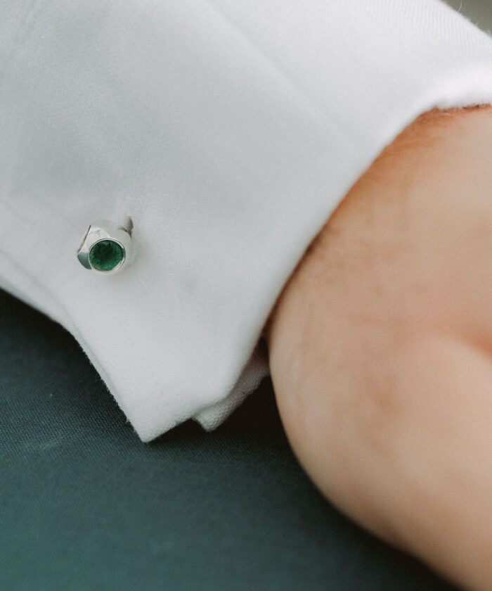 Elegant green gemstone cufflink for men's formal wear. Perfect accessory for dress shirts and special occasions.