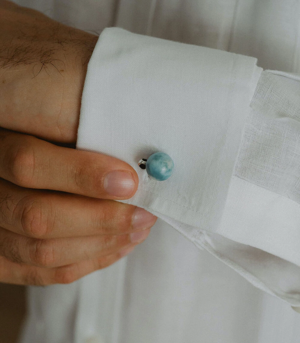 Larimar gemstone cufflinks with silver accents for elegant men's accessories.